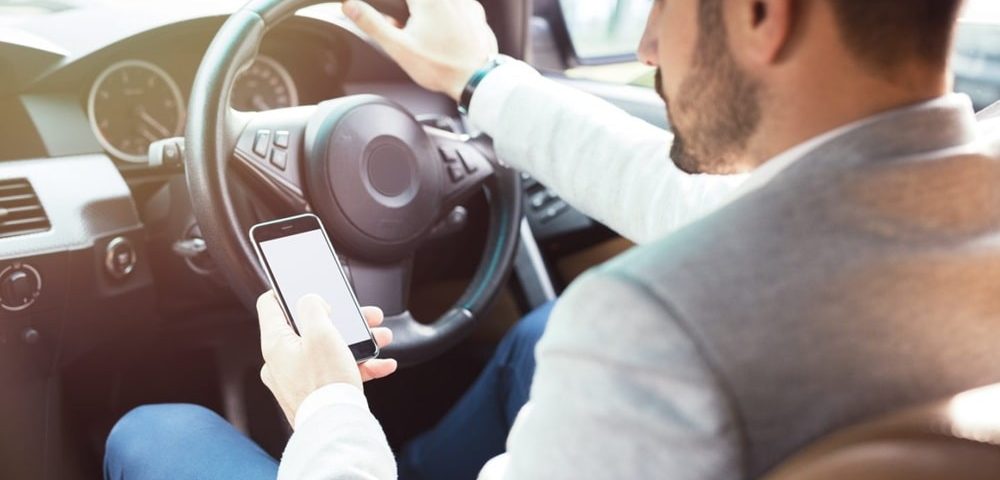 mobile phone driving law Dubai